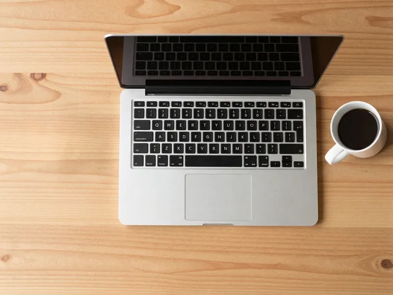 Coffee mug moved to the other side of a laptop